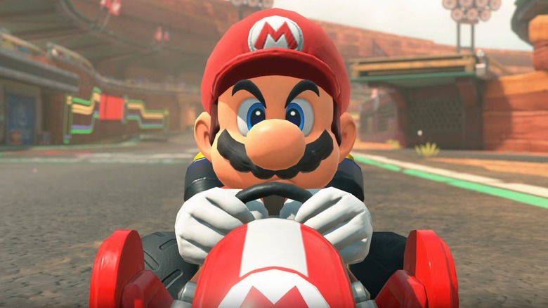 Mario sits in the driver's seat in 